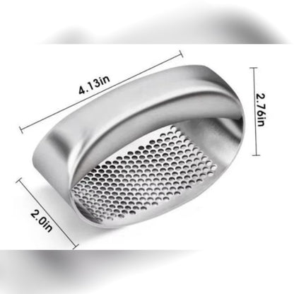 Vitlökspress med mått: ca 10,5 cm lång, 7 cm hög och 5 cm bred